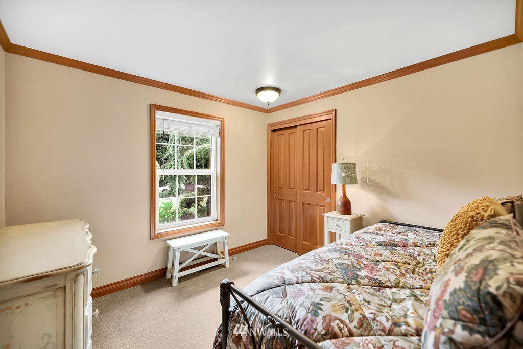 813 Bryant Road Sultan, WA 98294 - Photo 22 of 36 a bedroom with a bed and a window