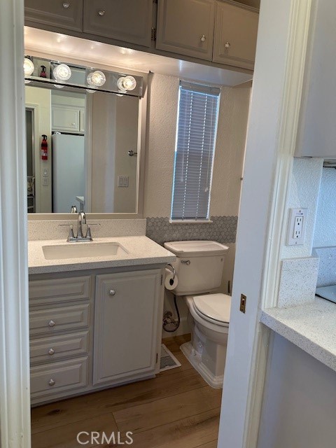 1334 Western Drive San Jacinto, CA 92583 - Photo 18 of 22 a bathroom with a sink vanity mirror and toilet
