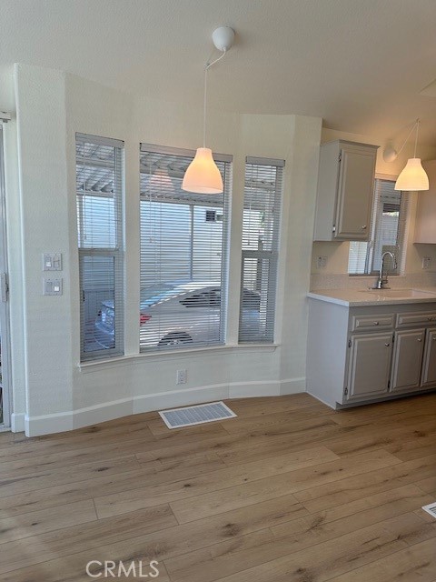 1334 Western Drive San Jacinto, CA 92583 - Photo 9 of 22 a view of a kitchen cabinets and wooden floor