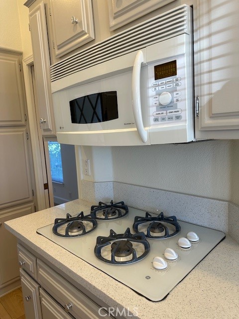 1334 Western Drive San Jacinto, CA 92583 - Photo 10 of 22 a kitchen with a stove and cabinets