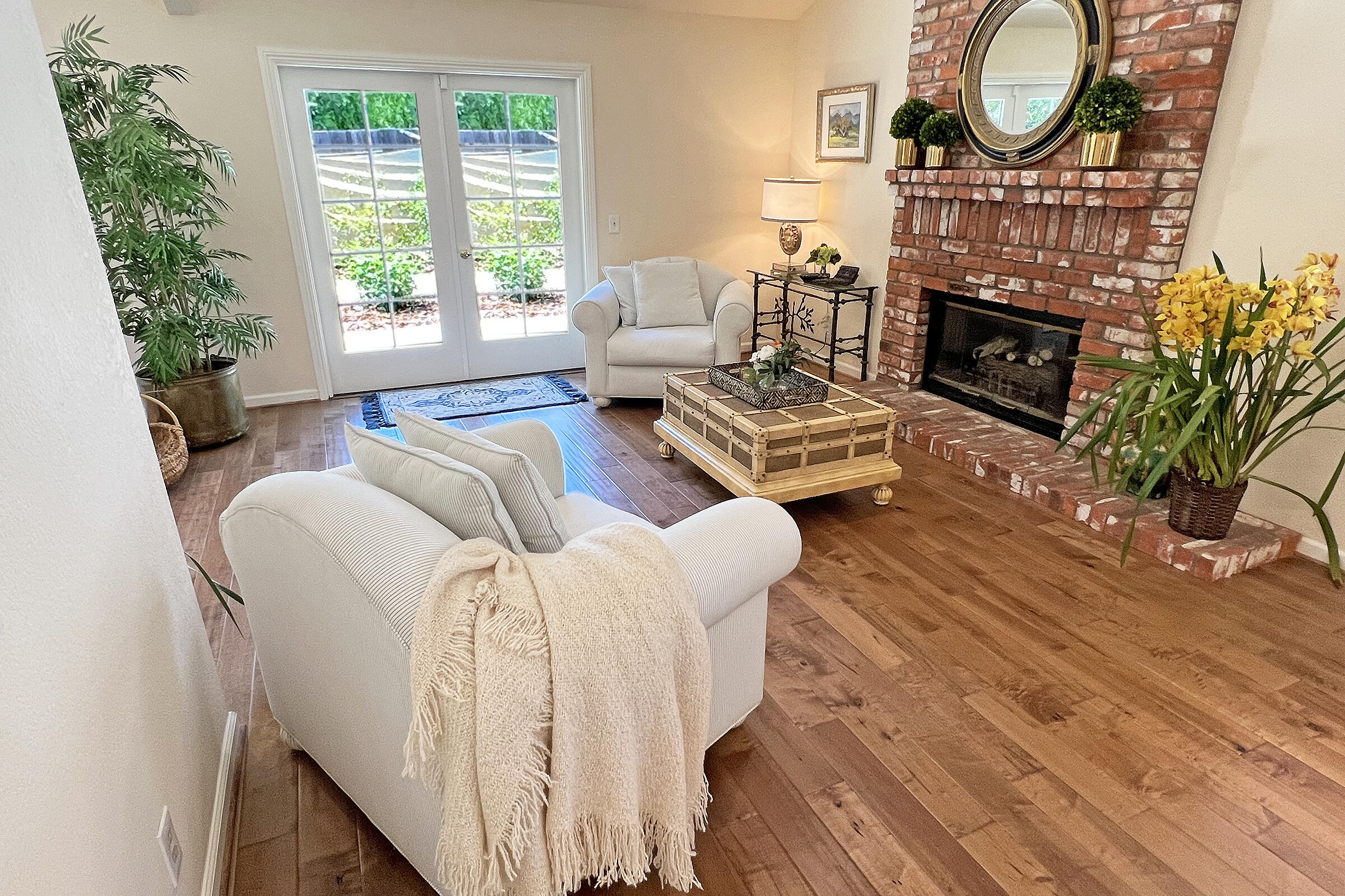 1485 Aarhus Drive Solvang, CA 93463 - Photo 12 of 27 a living room with furniture a large window and a fireplace
