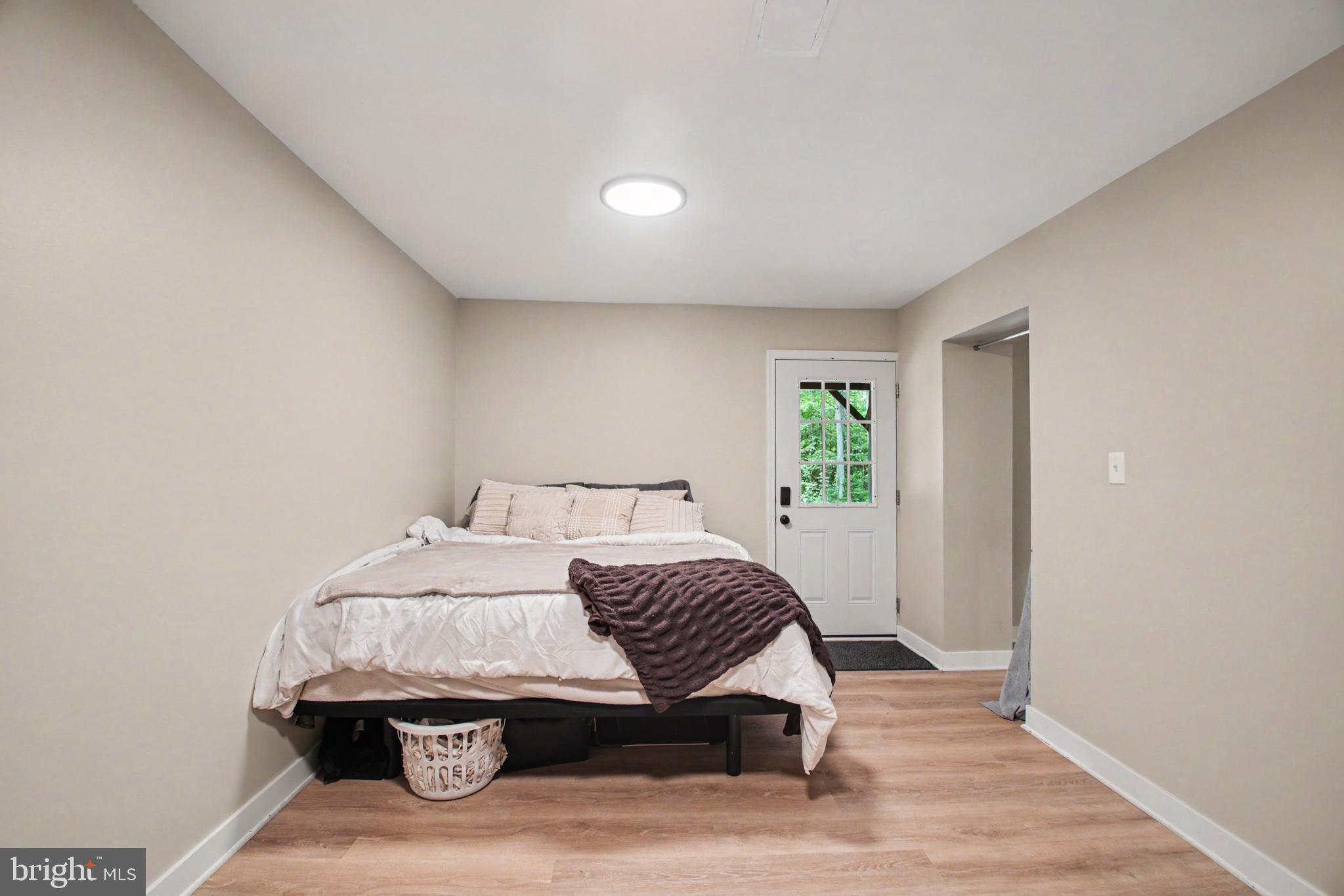 10224 Mill Pond Road Spotsylvania, VA 22551 - Photo 27 of 52 Bedroom 5 w/UPDATED LVP Floors & Door to Backyard