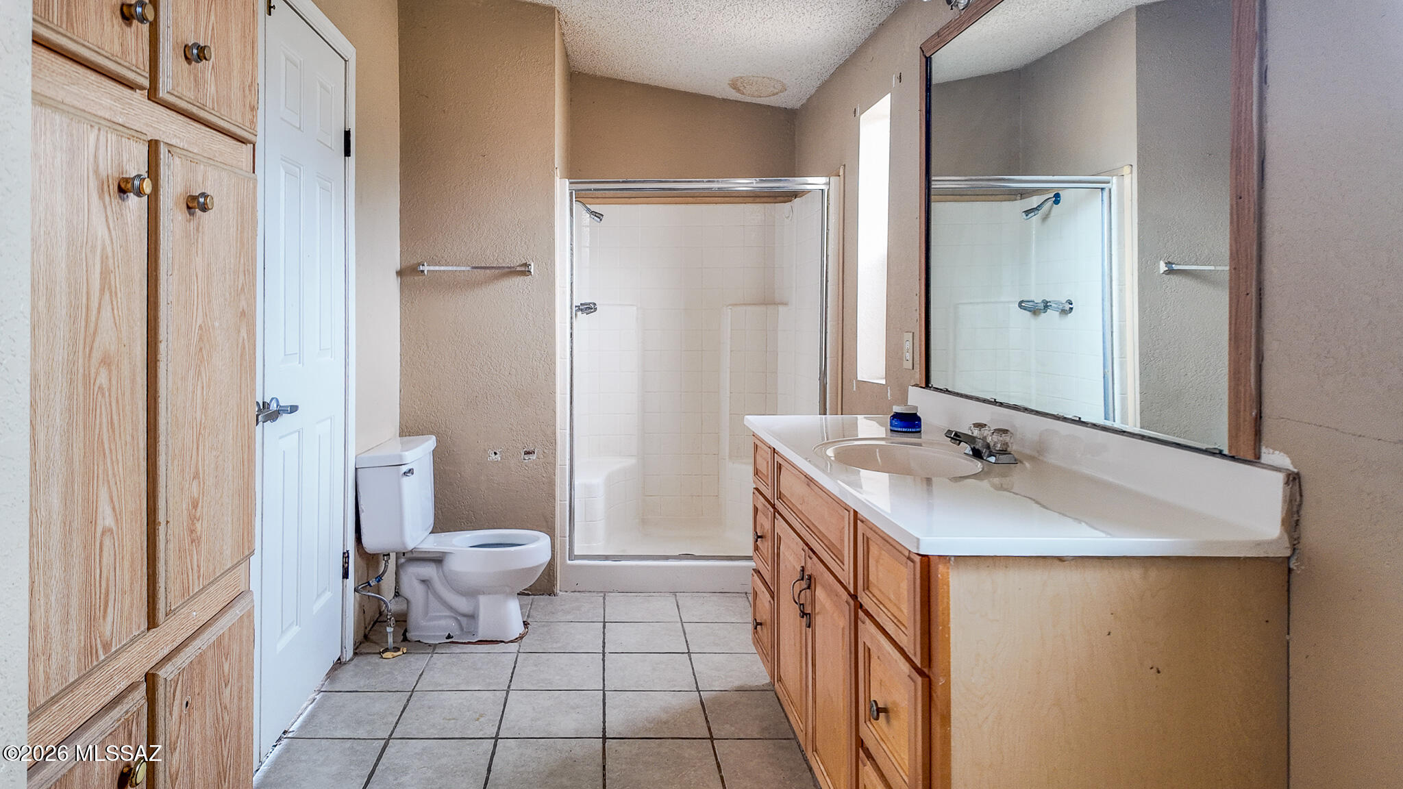 27651 South Canoa Road Amado, AZ 85645 - Photo 9 of 20 a bathroom with a sink a toilet and a large mirror