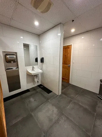 a view of a street with a building in the background