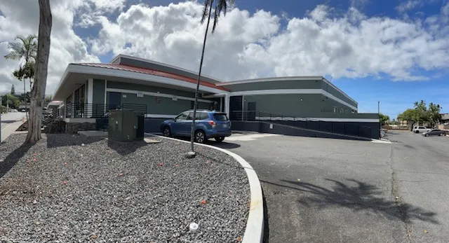 a view of a cafe with sitting area