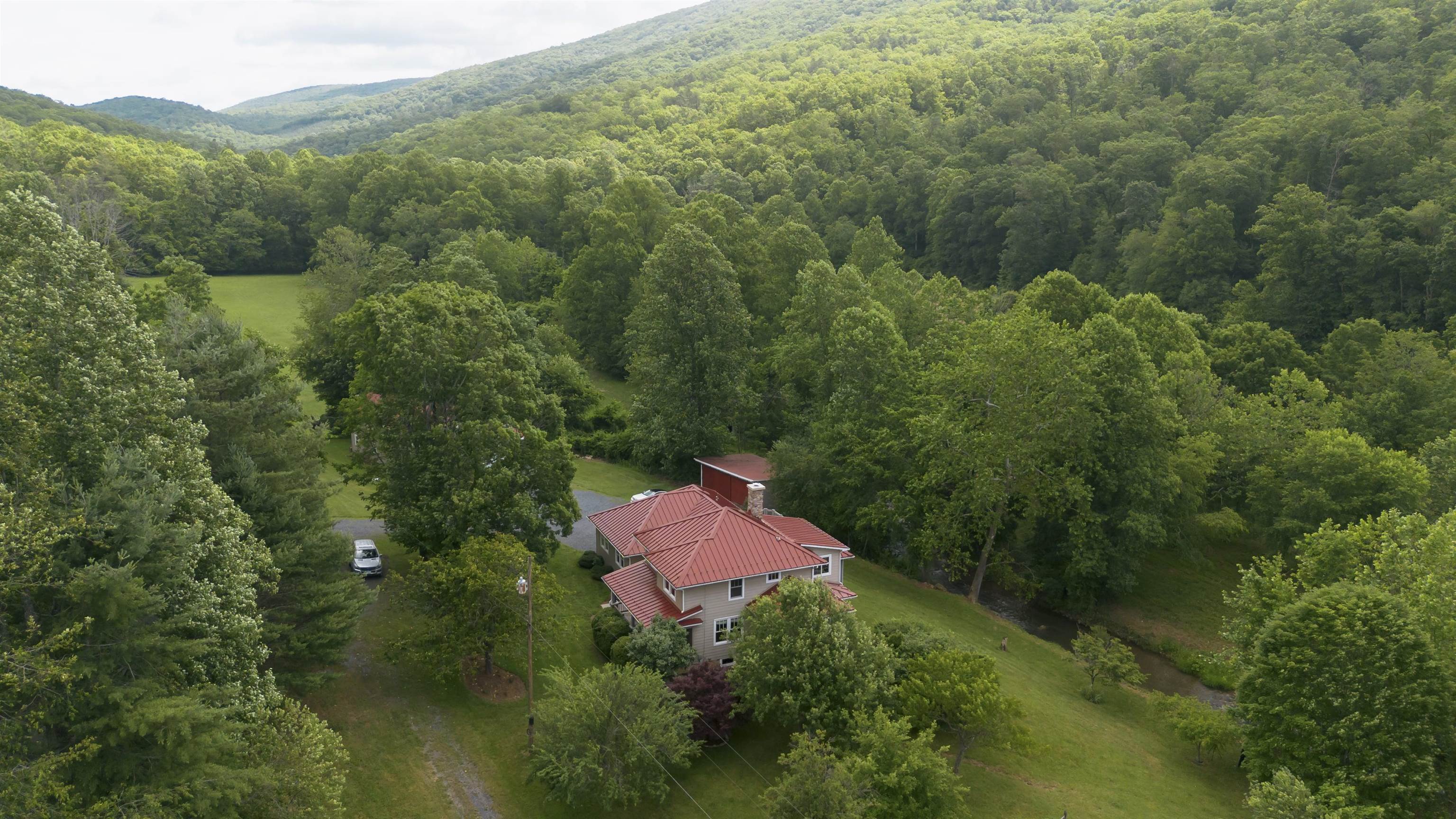 7304 Dry Run Road Williamsville, VA 24487 - Photo 54 of 57 an aerial view of a house with yard and outdoor seating
