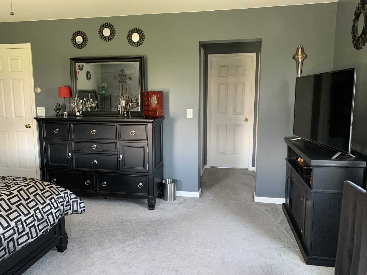 32 Spencer Lane Millerton, NY 12546 - Photo 26 of 29 a bedroom with a bed and a flat tv screen on dresser