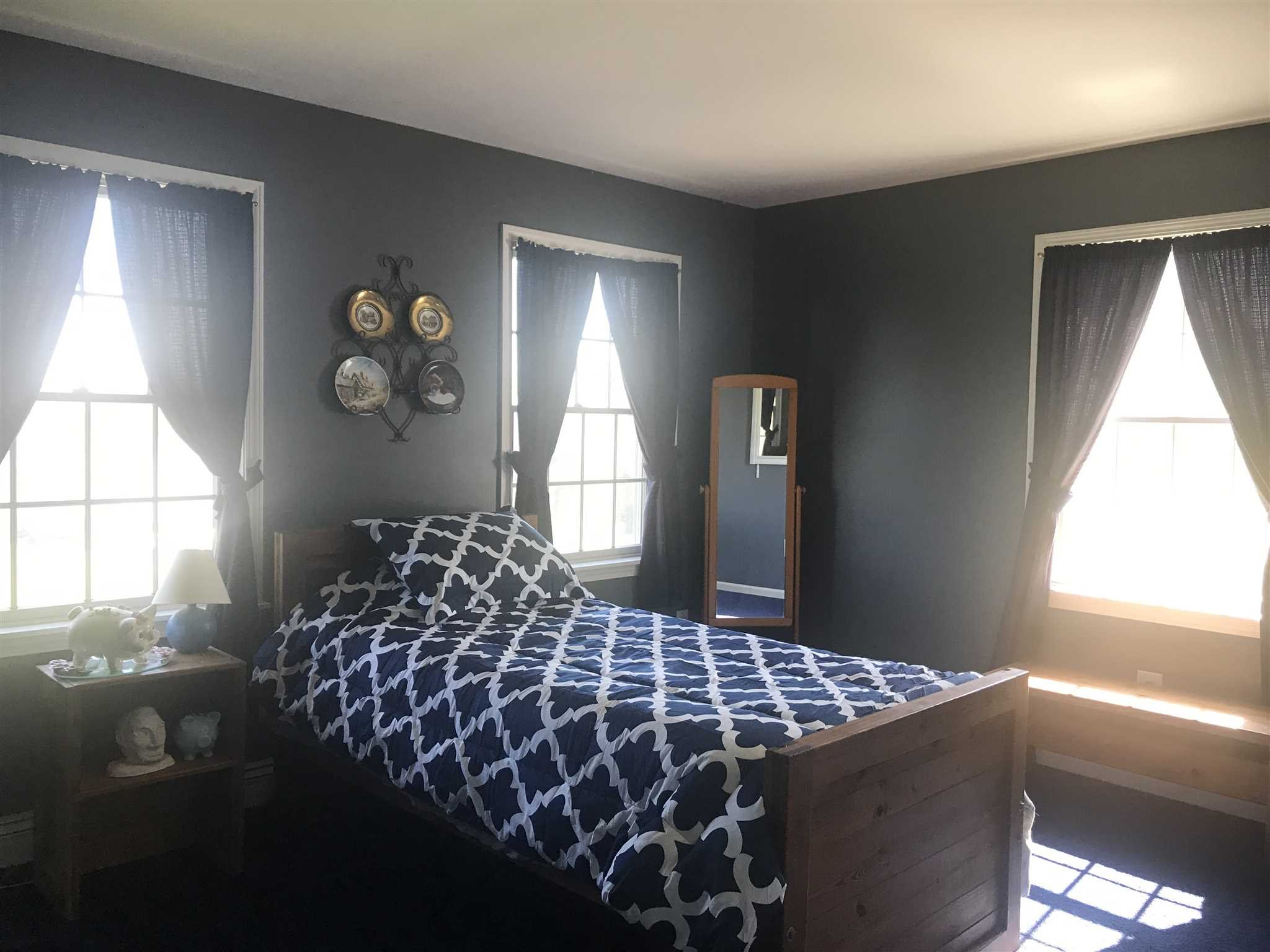 32 Spencer Lane Millerton, NY 12546 - Photo 27 of 29 a bed sitting in a bedroom next to a window