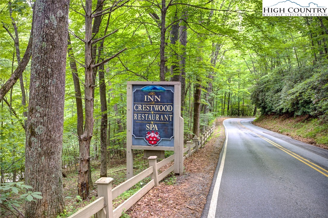 145 Inn At Crestwood Drive Boone, NC 28607 - Photo 18 of 18 a view of a sign board with large trees