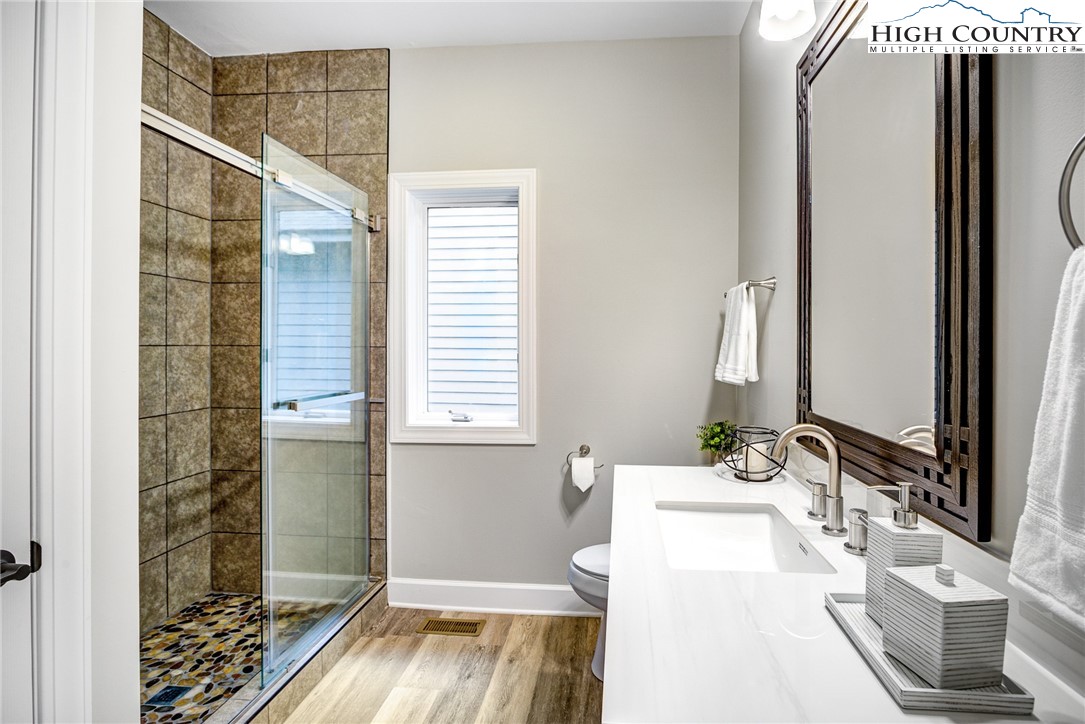145 Inn At Crestwood Drive Boone, NC 28607 - Photo 10 of 18 a en suite bathroom with a sink and a mirror