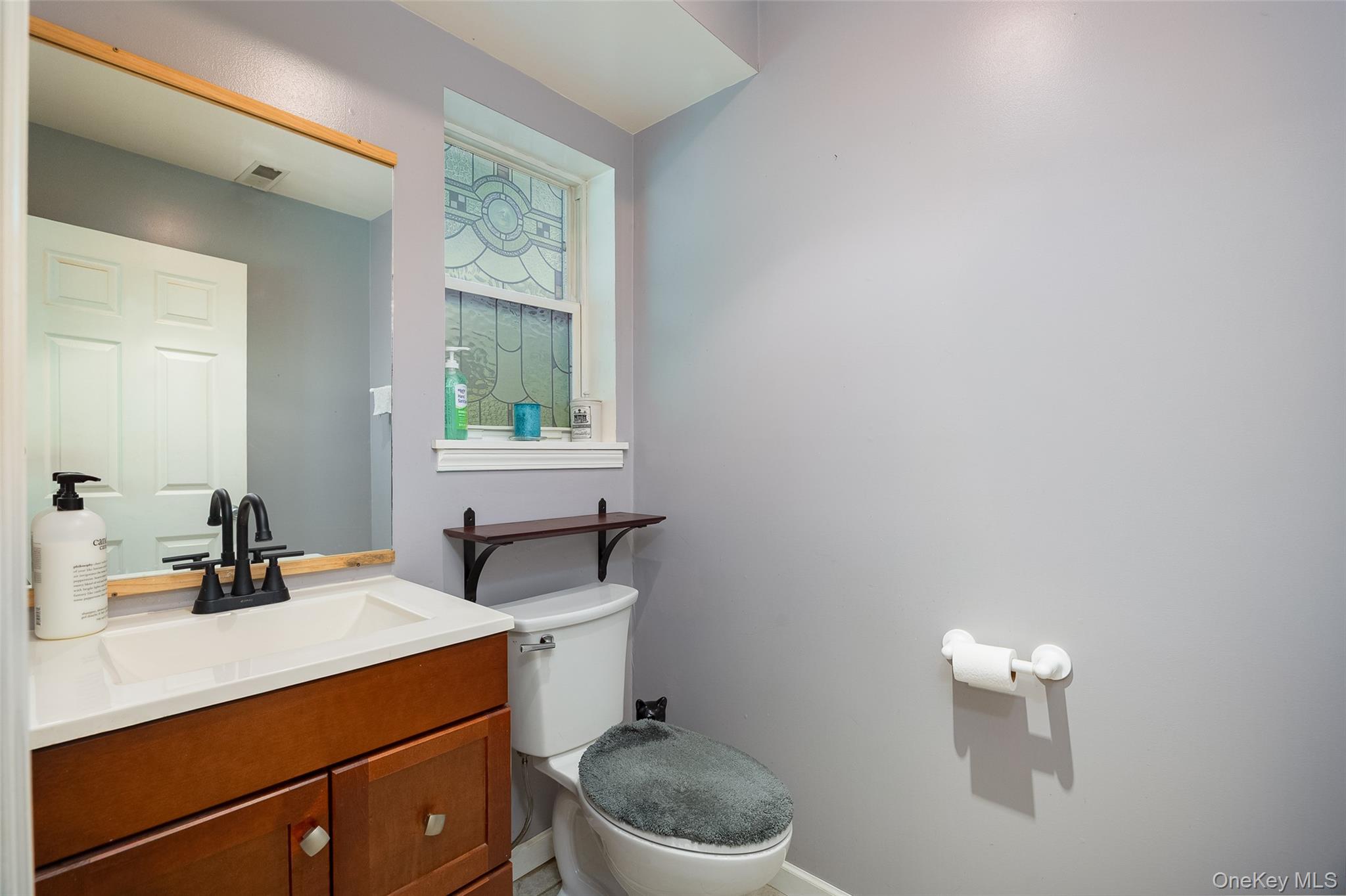 164 Bohl Road Hopewell Junction, NY 12533 - Photo 25 of 30 a bathroom with a toilet sink mirror and vanity