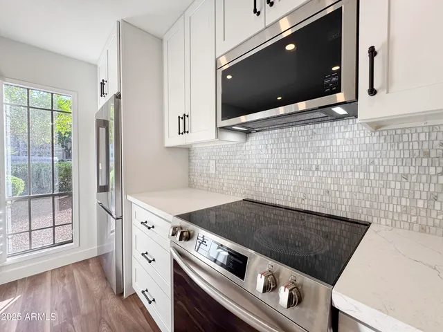 a bathroom with a glass shower door and a bathtub