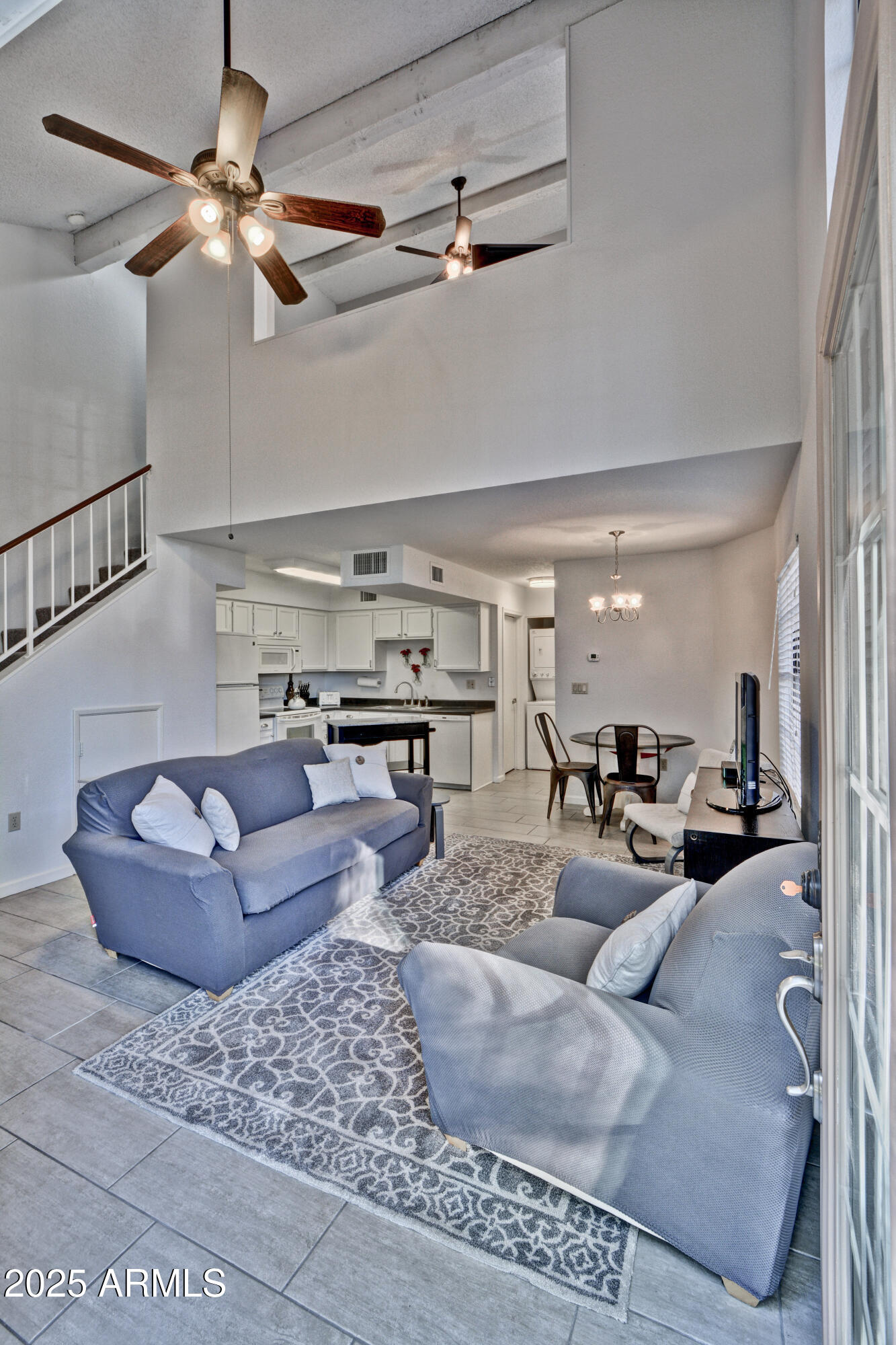 602 North May, Unit 23 Mesa, AZ 85201 - Photo 17 of 25 a living room with furniture and a chandelier
