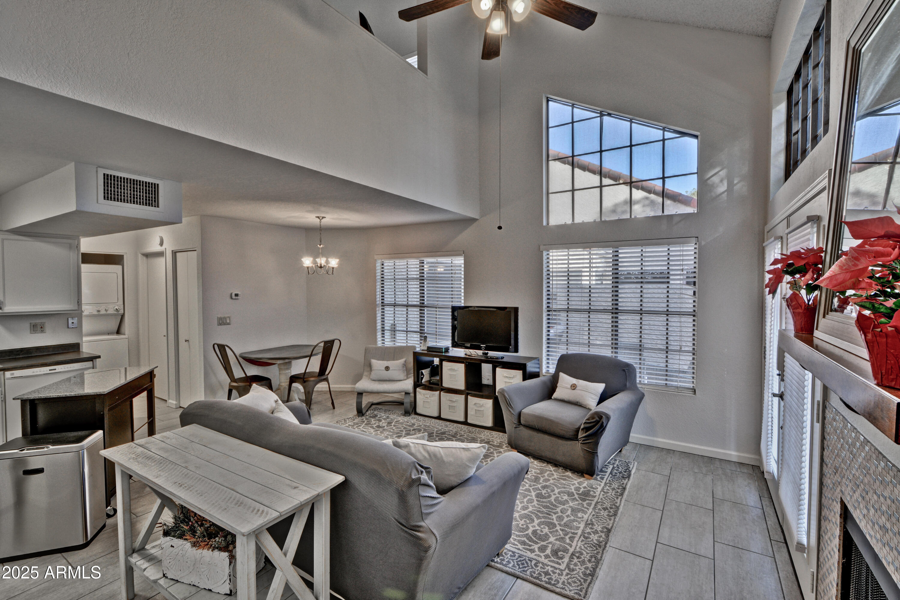 602 North May, Unit 23 Mesa, AZ 85201 - Photo 18 of 25 a living room with furniture and a chandelier
