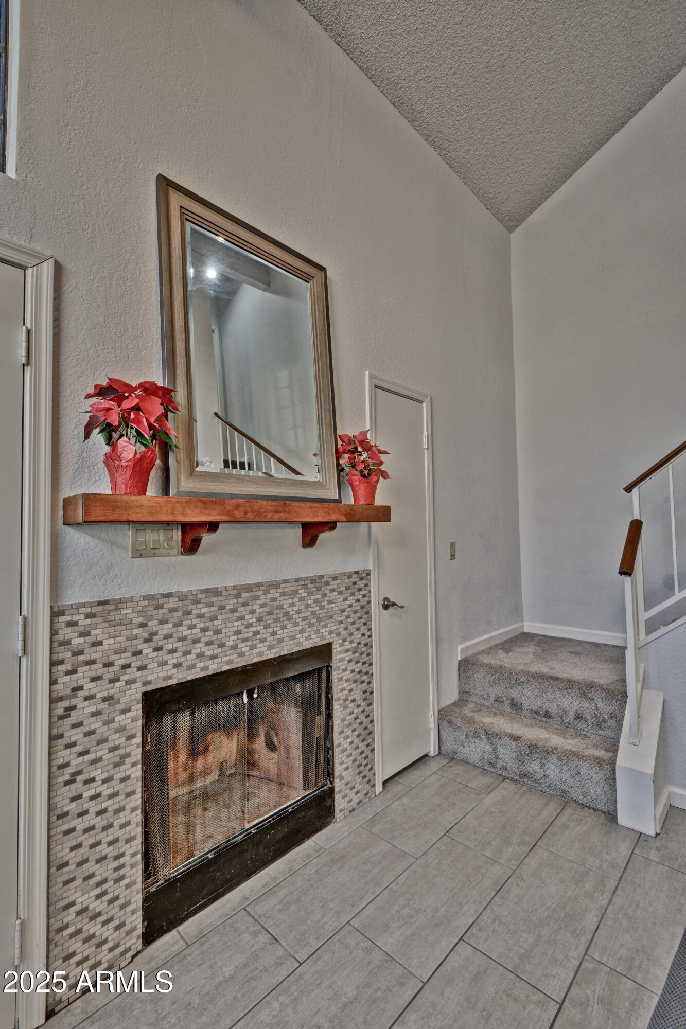 602 North May, Unit 23 Mesa, AZ 85201 - Photo 19 of 25 a living room with furniture and a fireplace