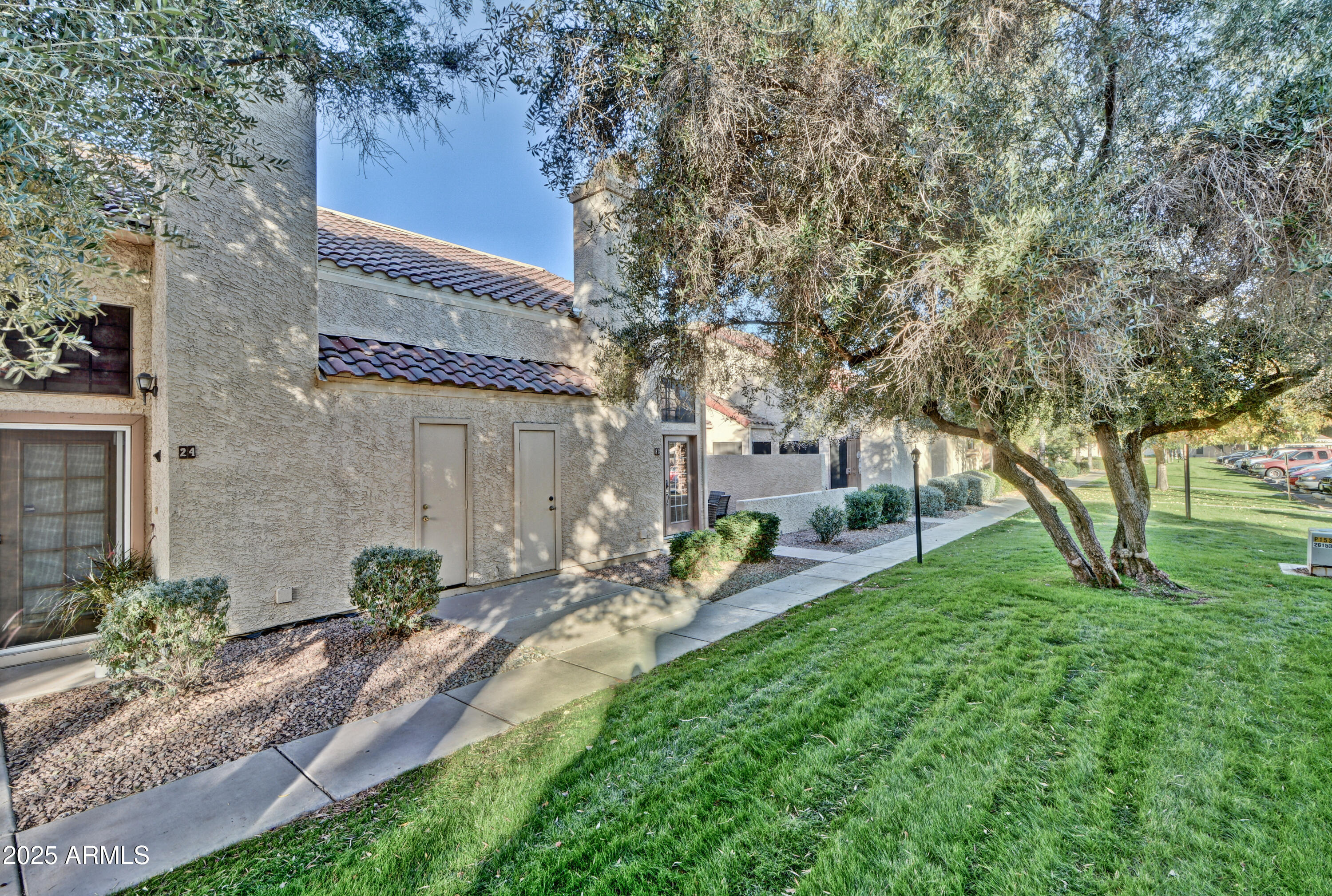 602 North May, Unit 23 Mesa, AZ 85201 - Photo 2 of 25 a backyard of a house with table and chairs