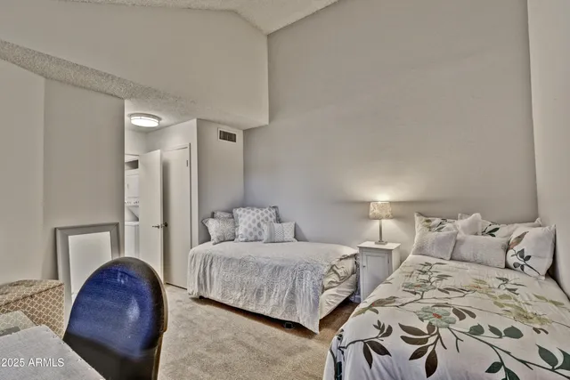 a bedroom with a bed and a couch