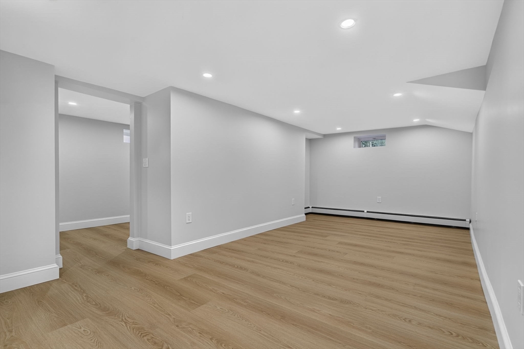 20 Saltonstall Road Medford, MA 02155 - Photo 34 of 41 a view of an empty room with wooden floor