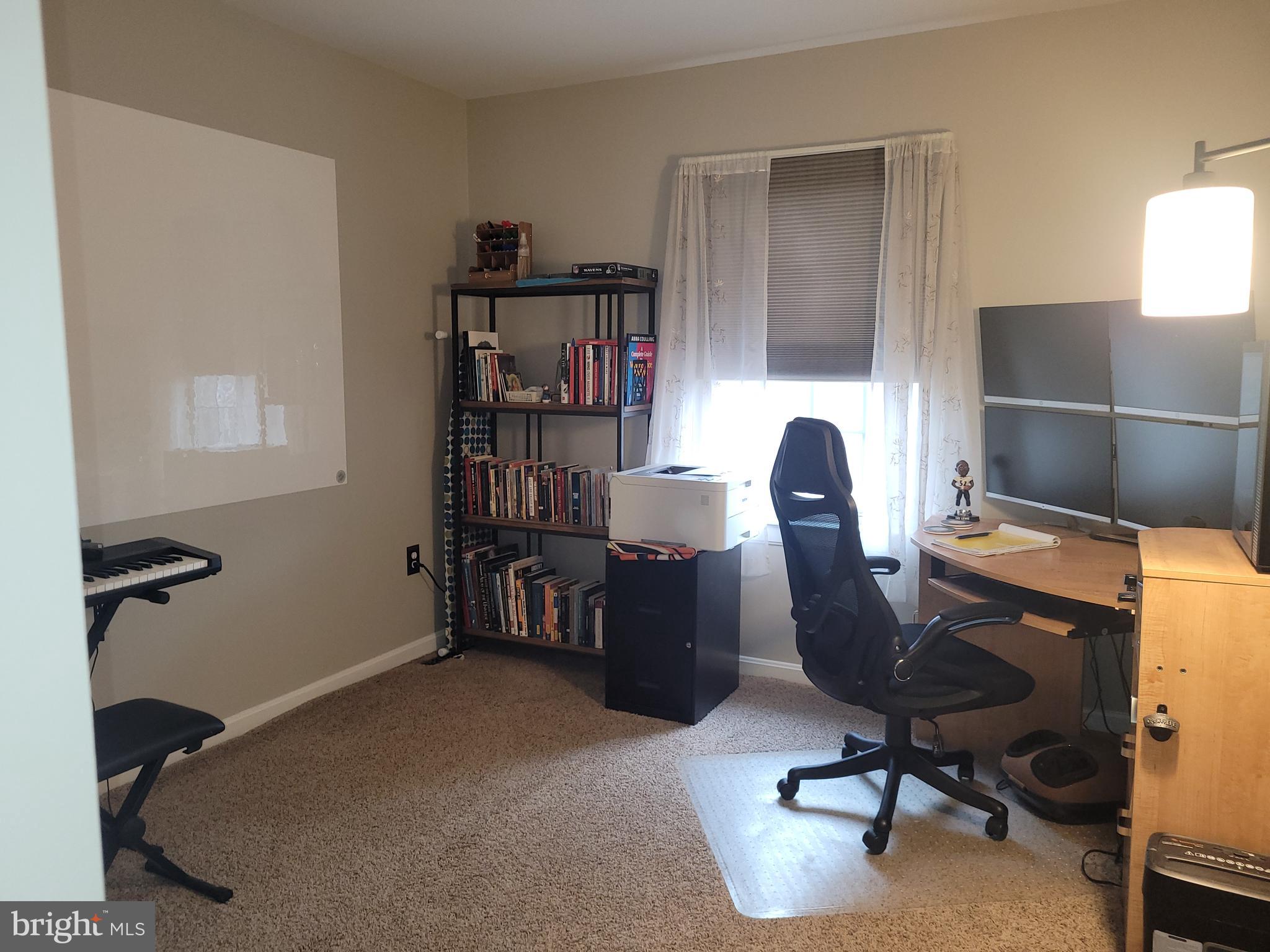 1045 Pond Ridge Drive Harrisburg, PA 17111 - Photo 14 of 25 a view of a workspace with furniture and a window