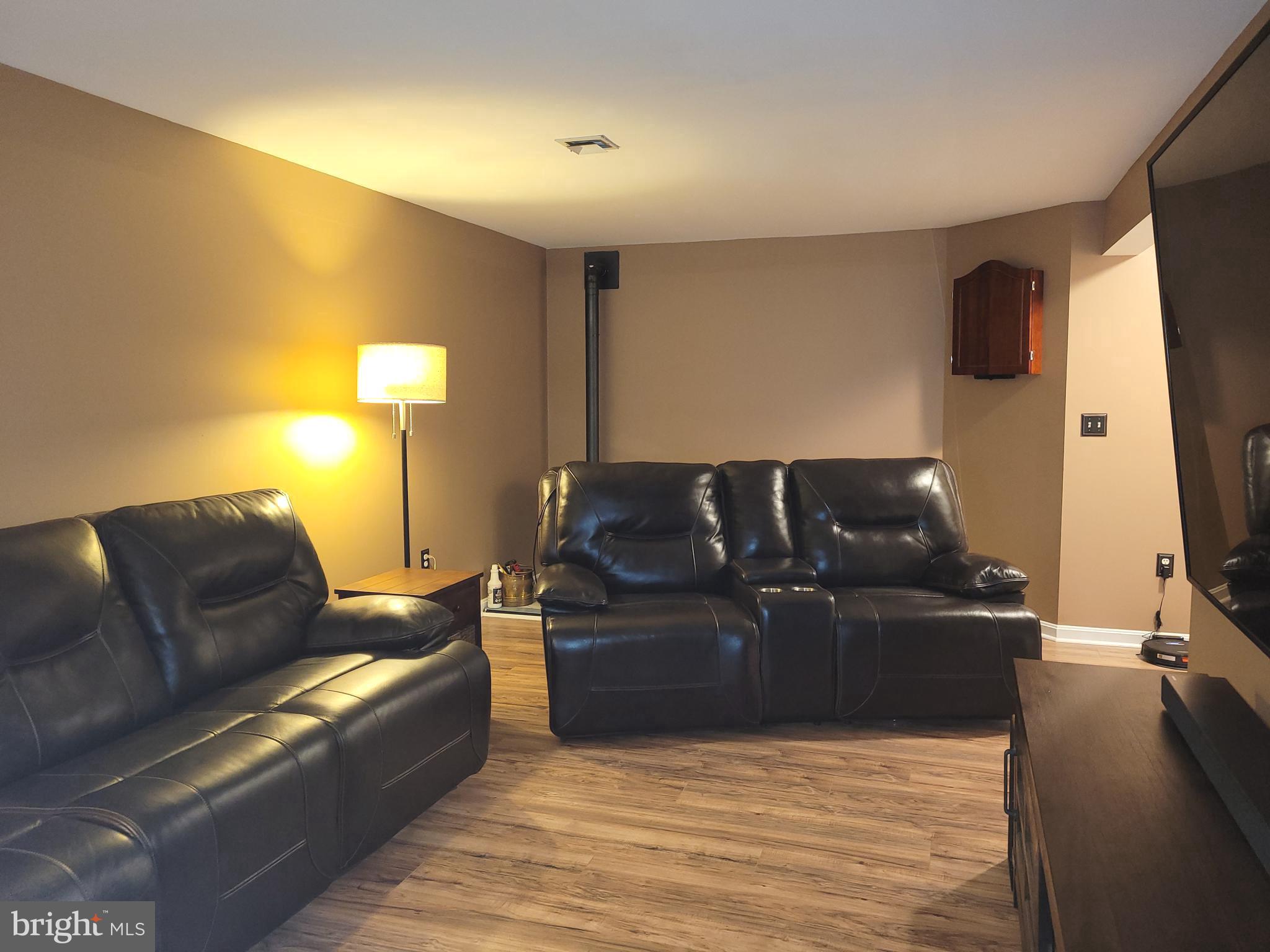 1045 Pond Ridge Drive Harrisburg, PA 17111 - Photo 16 of 25 a living room with furniture and a flat screen tv