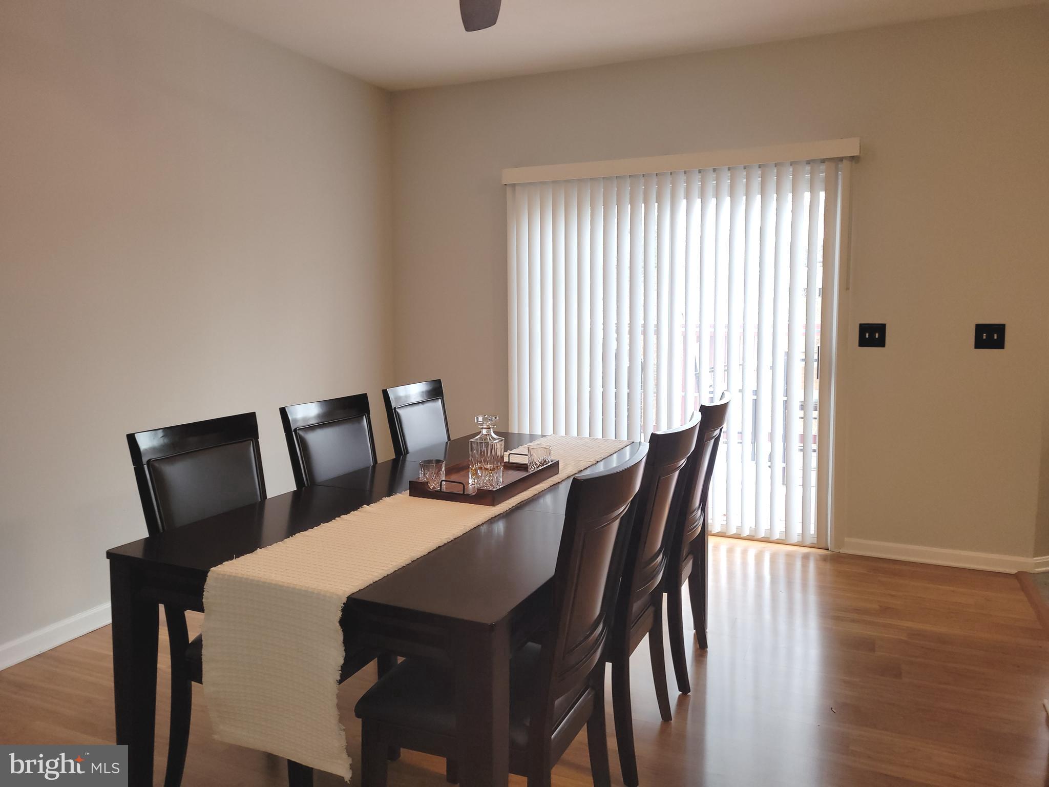 1045 Pond Ridge Drive Harrisburg, PA 17111 - Photo 6 of 25 a view of a dining room with furniture and wooden floor
