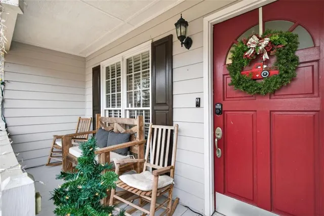 a front view of a house with outdoor seating