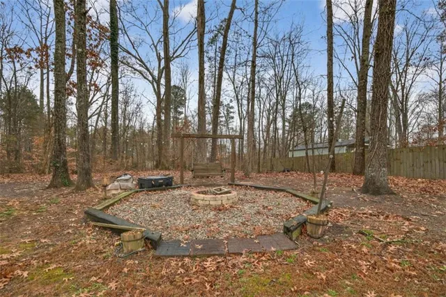 a backyard of apartments with large trees