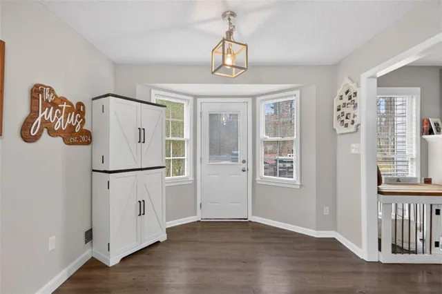 a view of entryway with wooden floor