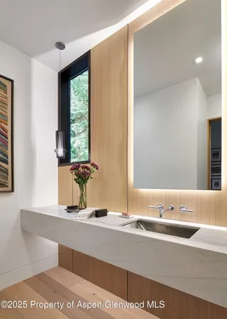 a bathroom with a sink and a mirror