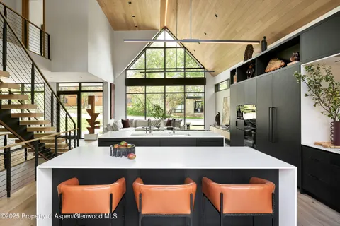 a kitchen with a sink and large window