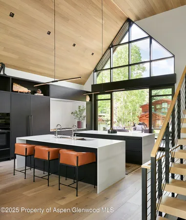 a room with large window and furniture