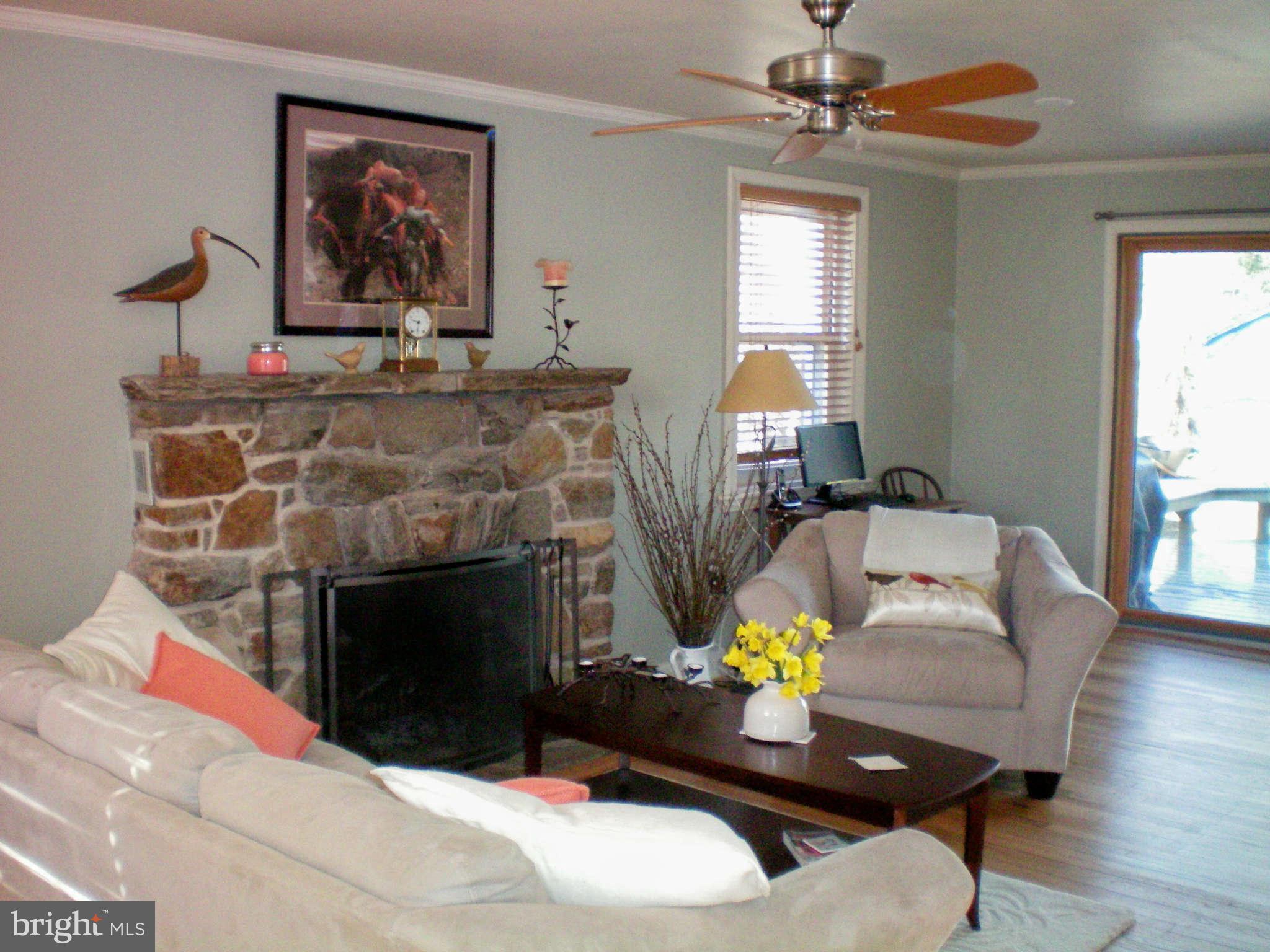 2508 Pinebrush Road Baltimore, MD 21209 - Photo 2 of 30 a living room with furniture and a fireplace