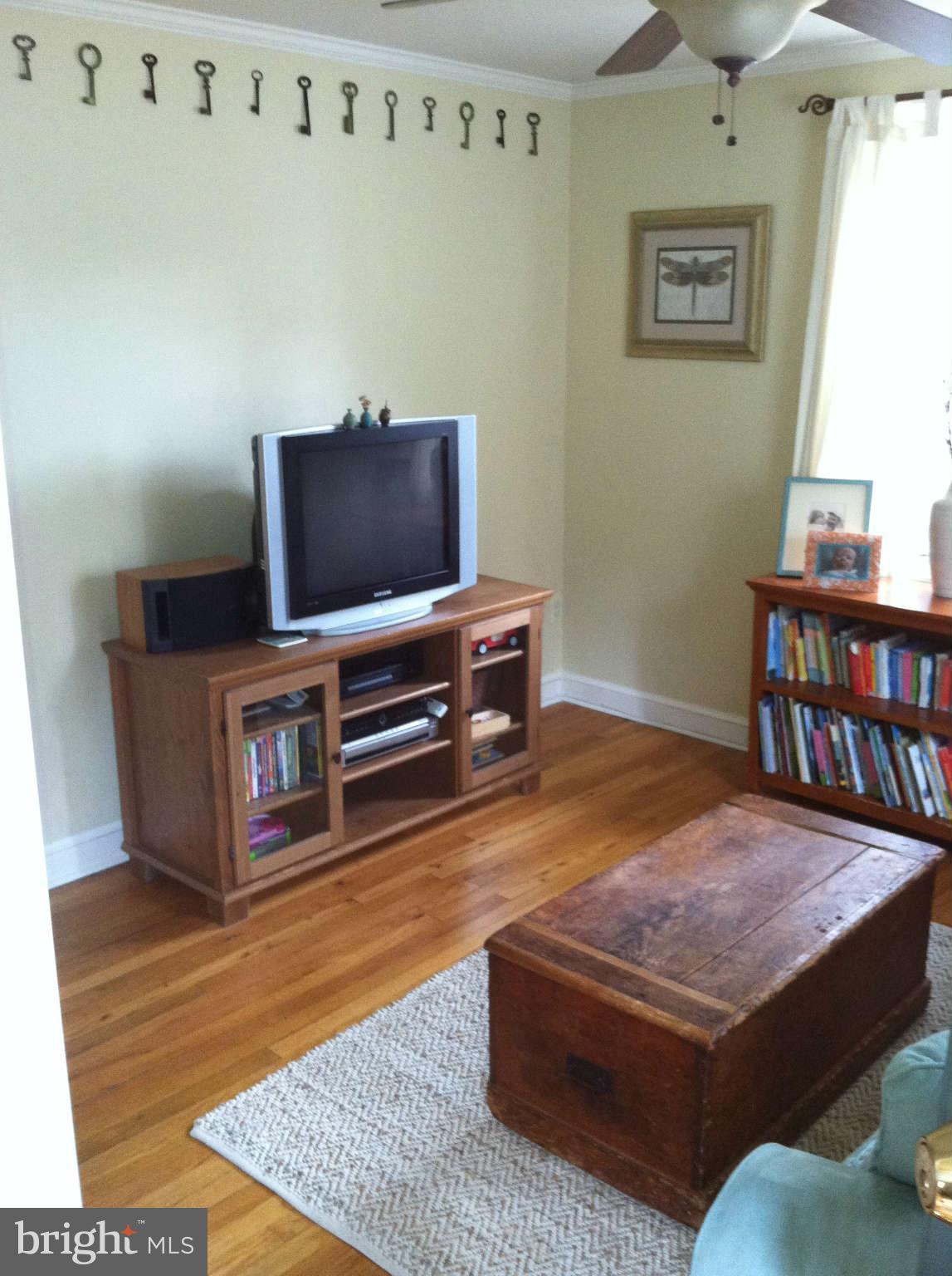 2508 Pinebrush Road Baltimore, MD 21209 - Photo 16 of 30 a living room with furniture and a wooden floor