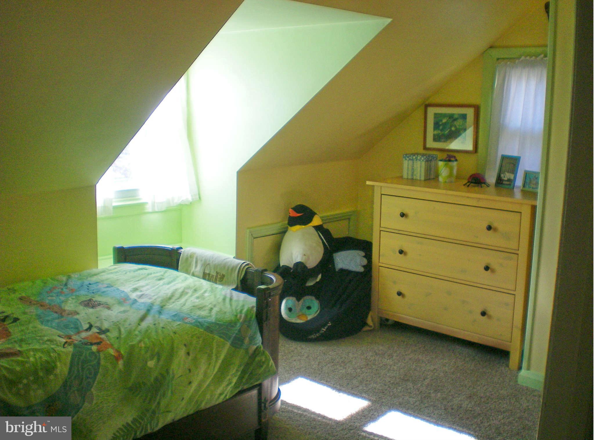 2508 Pinebrush Road Baltimore, MD 21209 - Photo 21 of 30 a bedroom with a bed and a dresser