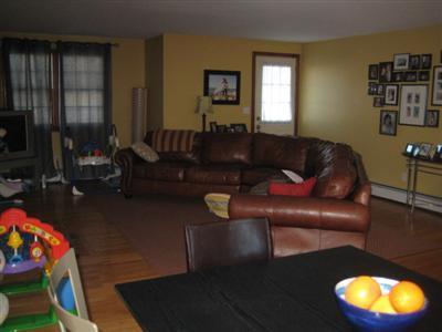 33 James Otis Road Centerville, MA 02632 - Photo 6 of 8 a living room with furniture and a lamp