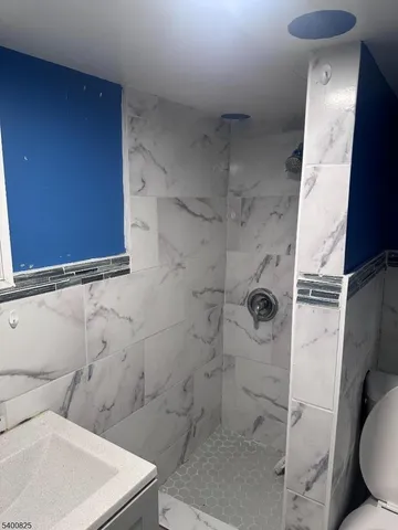 a bathroom with a toilet and shower
