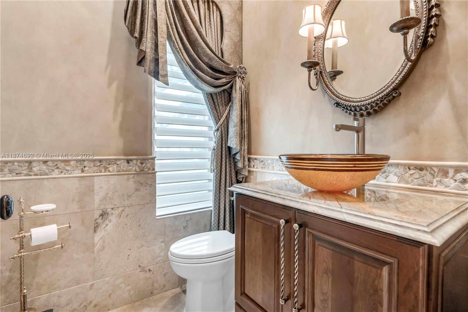 700 47th Street Boca Raton, FL 33431 - Photo 11 of 73 a bathroom with a granite countertop sink a toilet and a mirror