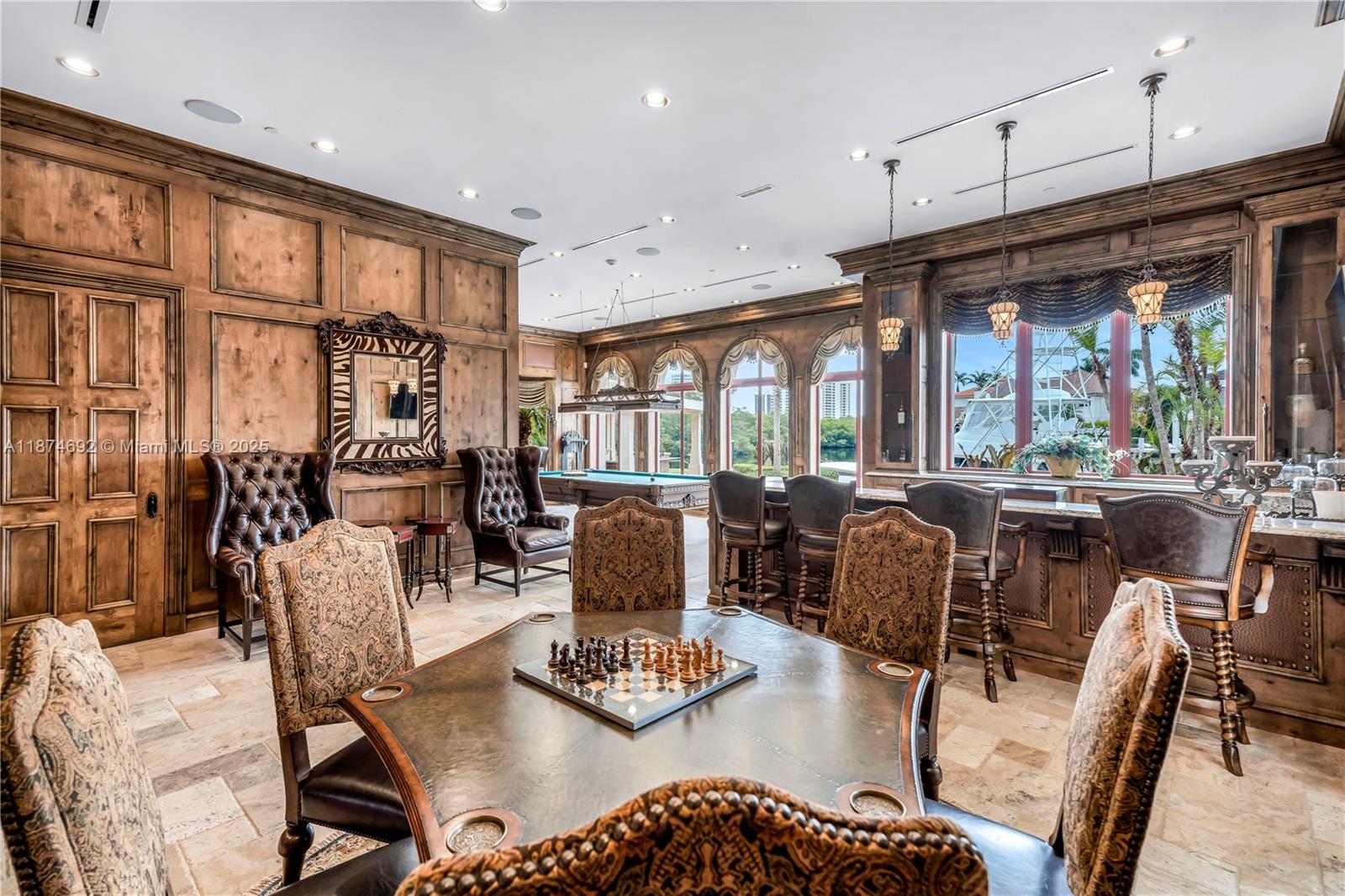 700 47th Street Boca Raton, FL 33431 - Photo 13 of 73 a living room with lots of furniture and a chandelier