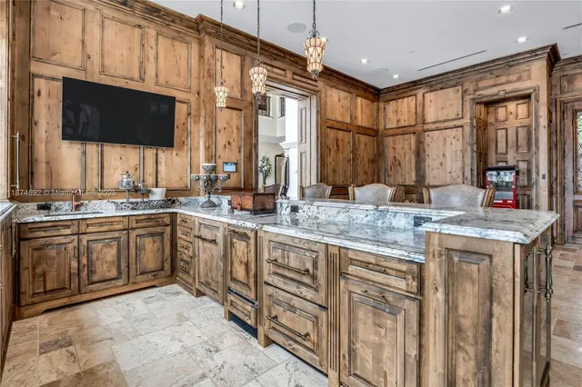a kitchen with stainless steel appliances granite countertop a stove and cabinets