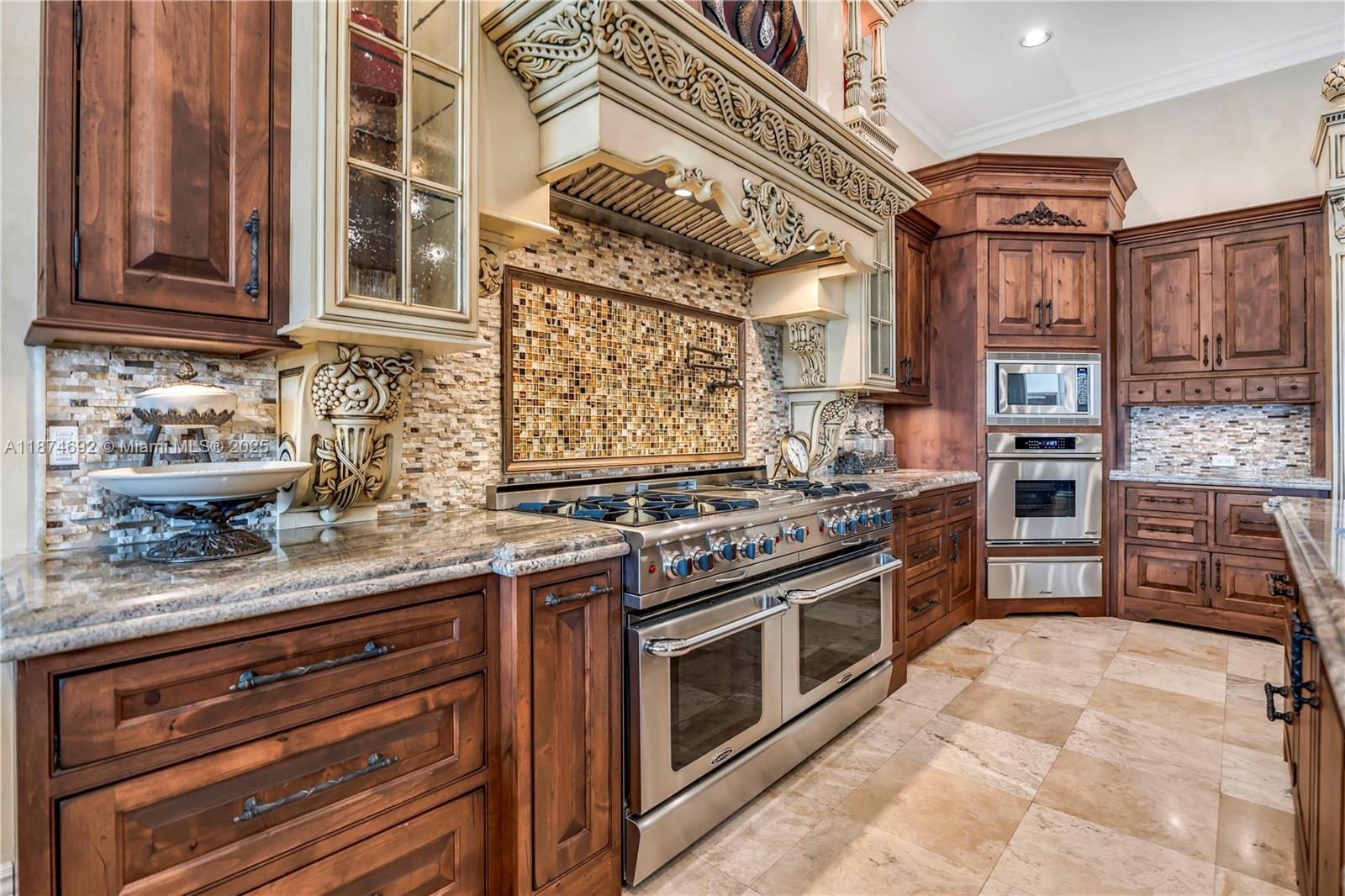 700 47th Street Boca Raton, FL 33431 - Photo 22 of 73 a kitchen with stainless steel appliances granite countertop a stove and a sink