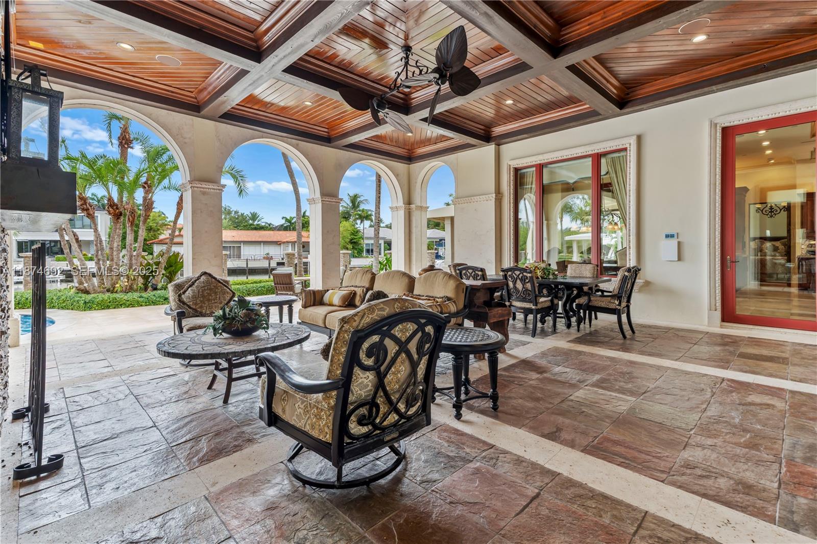 700 47th Street Boca Raton, FL 33431 - Photo 30 of 73 a building outdoor space with patio furniture and potted plants
