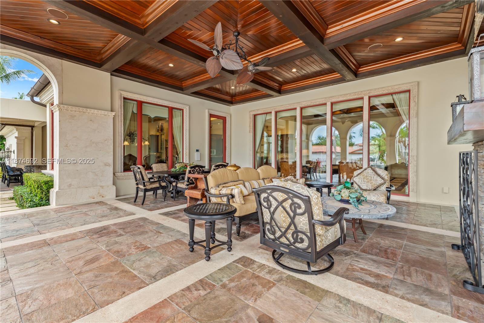 700 47th Street Boca Raton, FL 33431 - Photo 31 of 73 a building outdoor space with patio furniture and potted plants