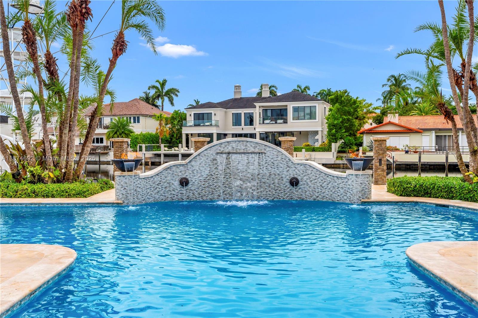 700 47th Street Boca Raton, FL 33431 - Photo 33 of 73 a front view of a house with swimming pool table and chairs