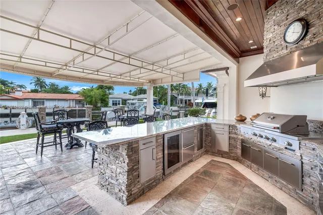 a spacious bathroom with a granite countertop sink and a mirror
