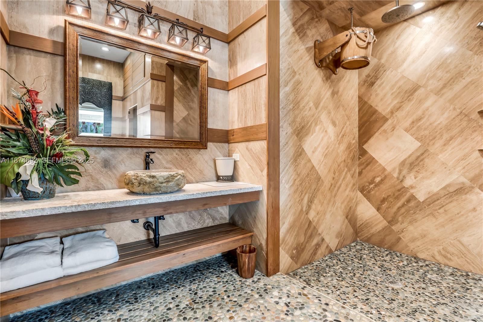 700 47th Street Boca Raton, FL 33431 - Photo 41 of 73 a bathroom with a sink and a mirror