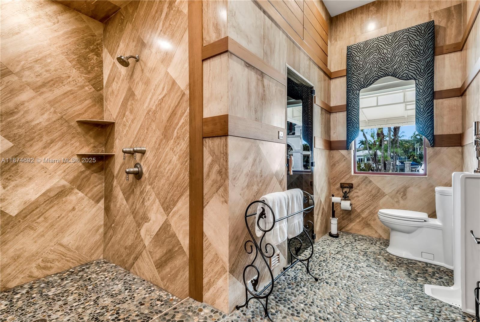 700 47th Street Boca Raton, FL 33431 - Photo 42 of 73 a bathroom with a toilet sink and shower