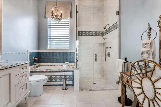 a view of a house with a yard and potted plants