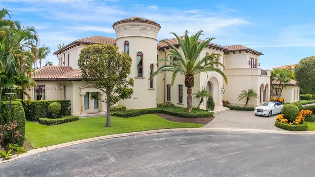 a living room with patio furniture and a fireplace