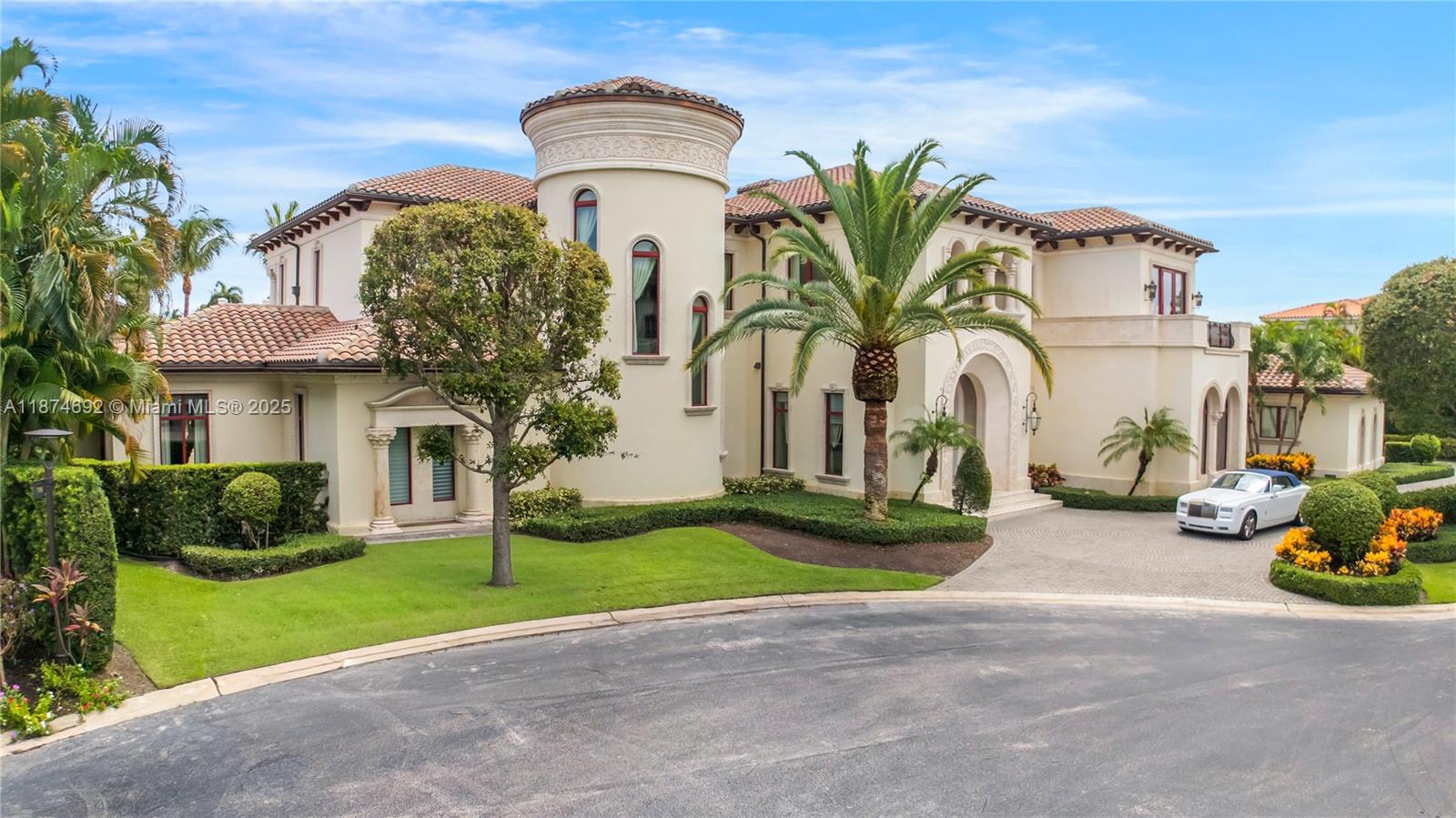 700 47th Street Boca Raton, FL 33431 - Photo 5 of 73 a front view of a house with garden