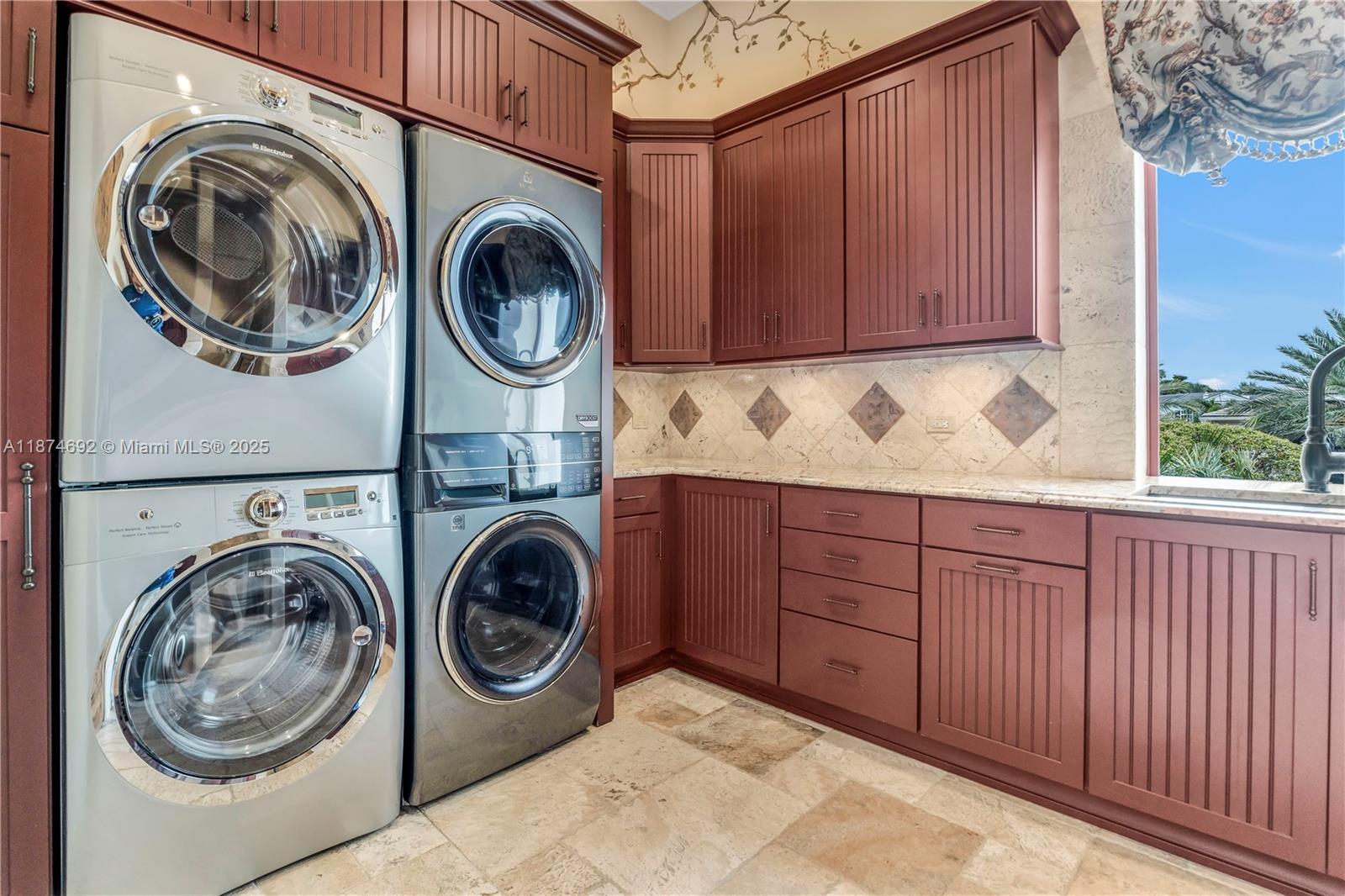 700 47th Street Boca Raton, FL 33431 - Photo 54 of 73 a utility room with sink dryer and washer